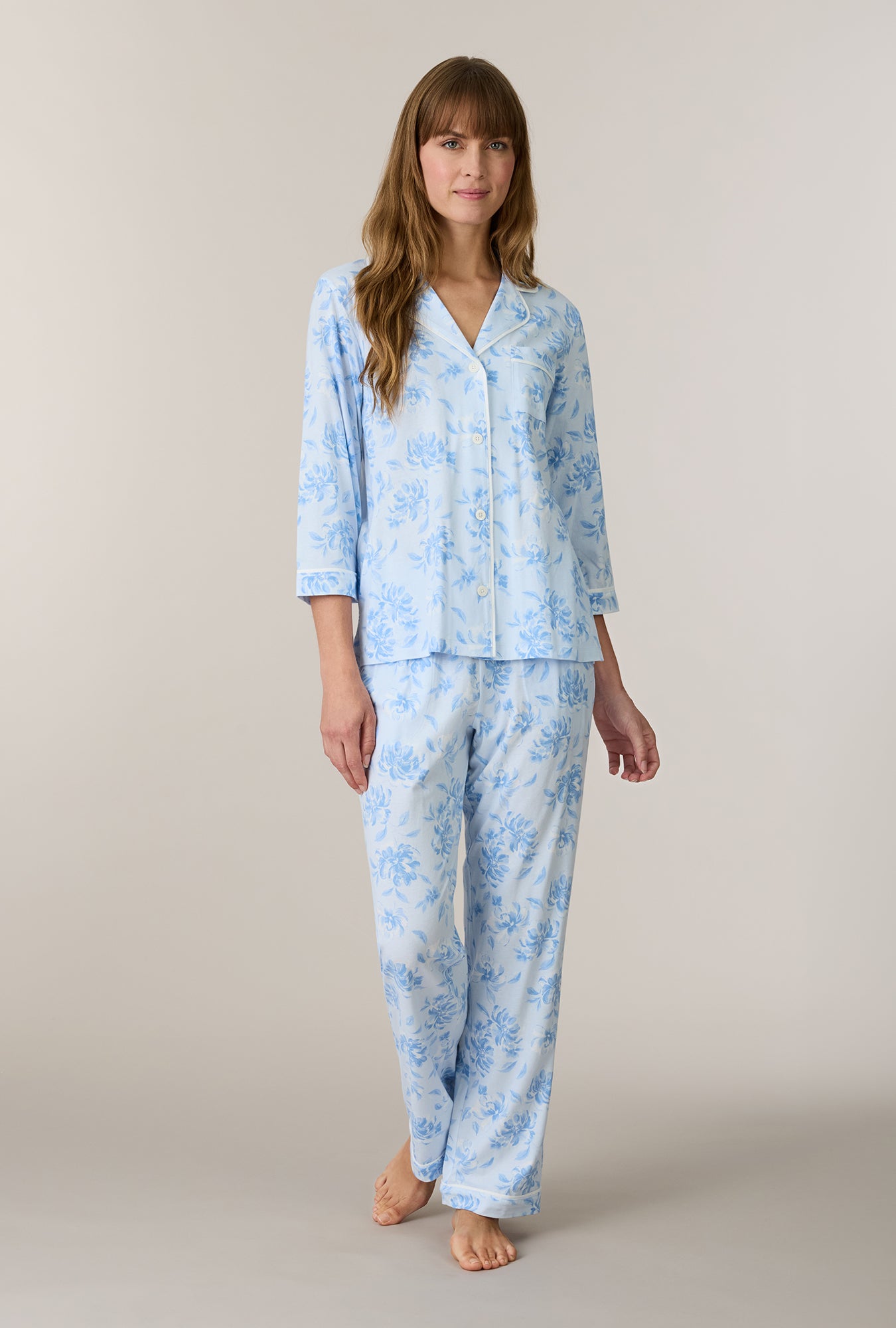 A lady wearing Garden Mist Cotton Notch Collar Long Pajama Set looking up