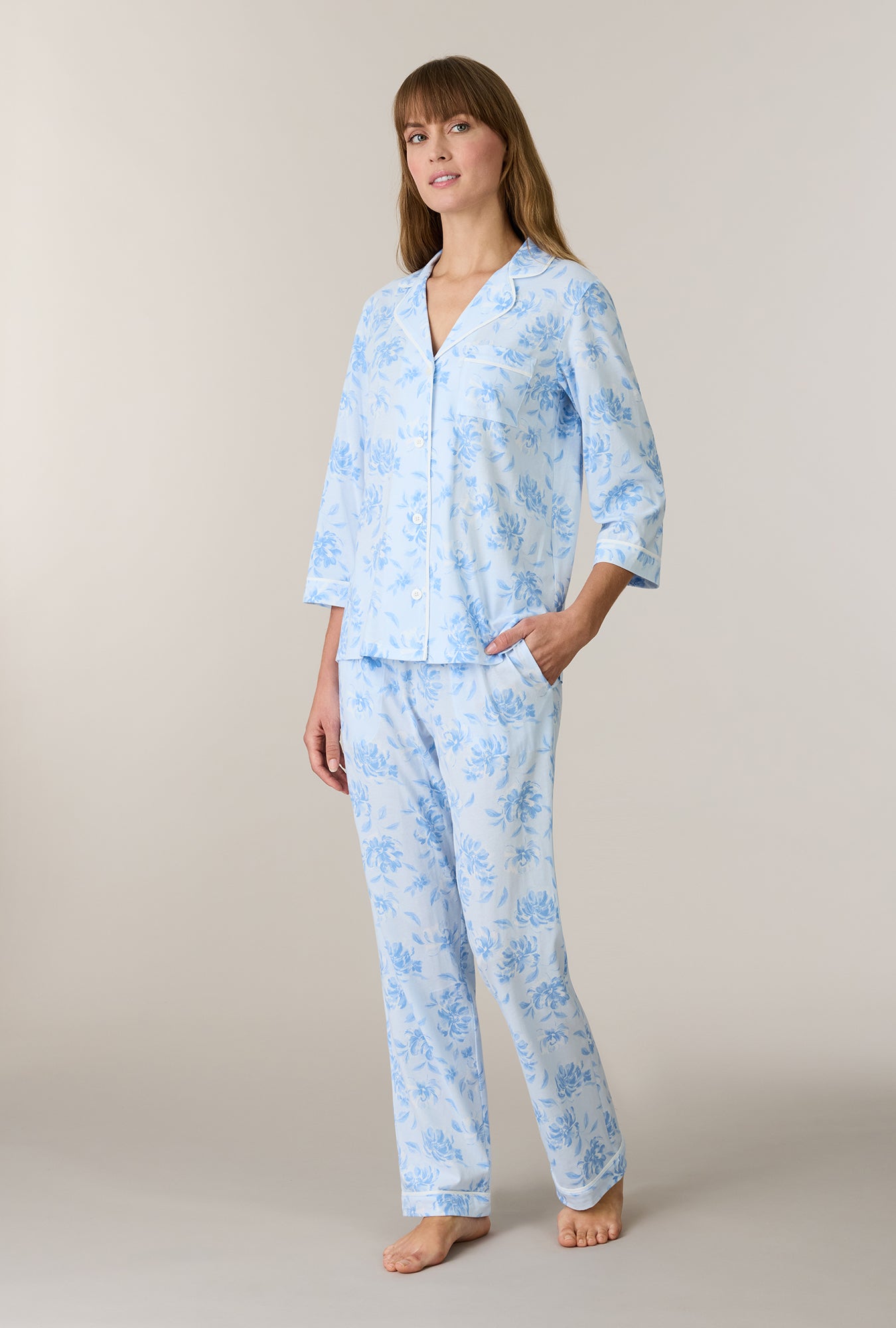 A lady wearing Garden Mist Cotton Notch Collar Long Pajama Set looking up