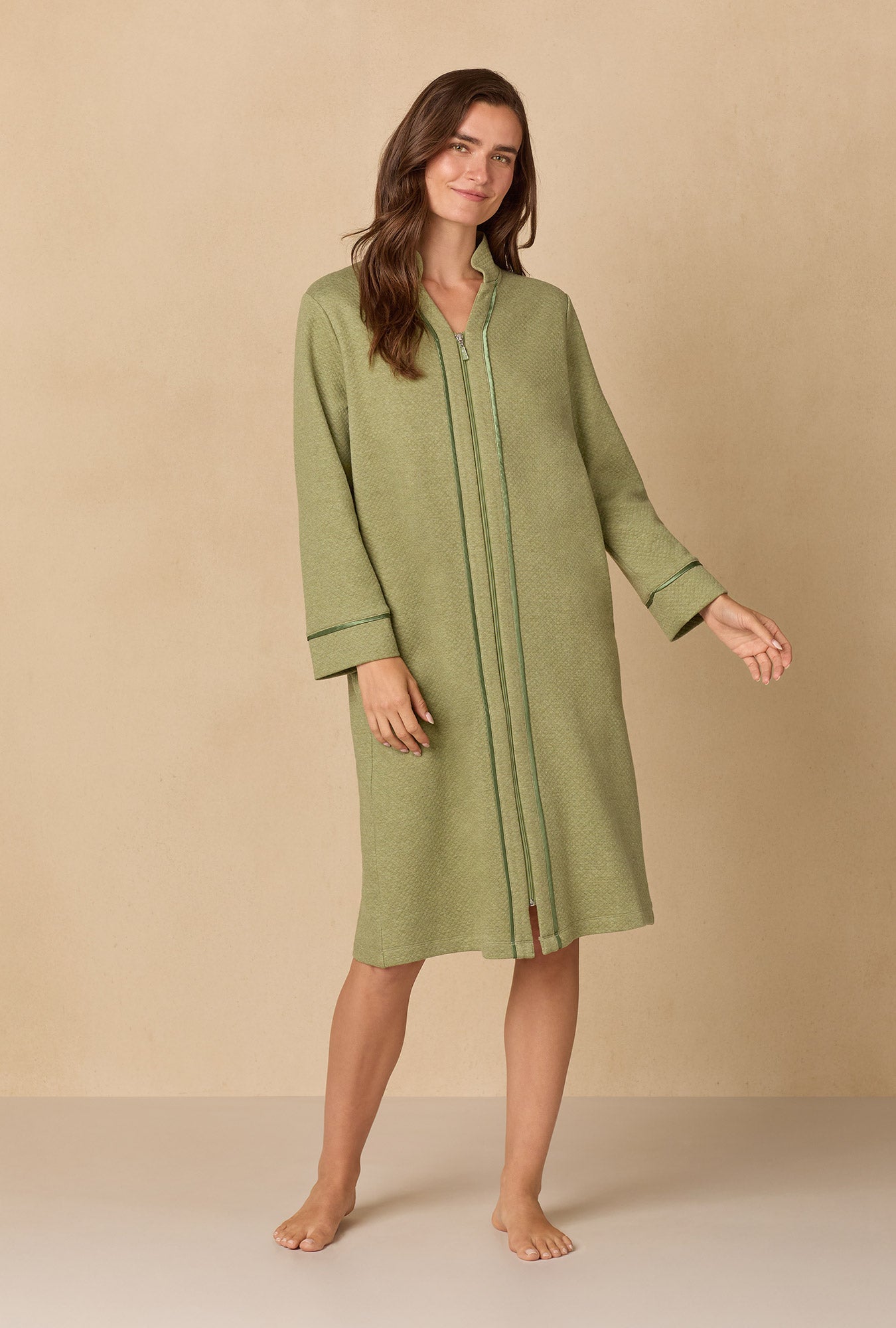 A lady wearing Heather Sage Diamond Quilted Zip Robe