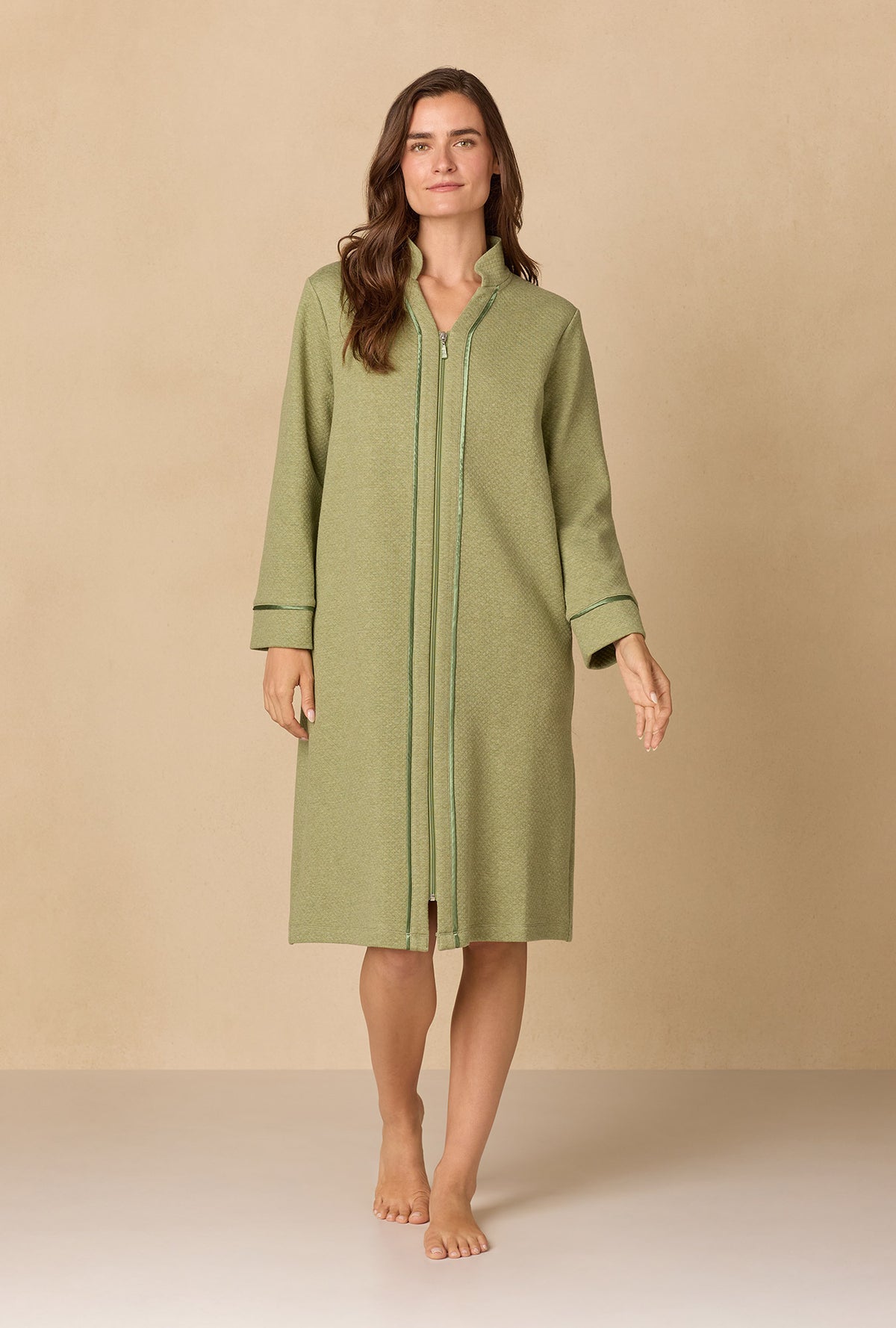 A lady wearing Heather Sage Diamond Quilted Zip Robe