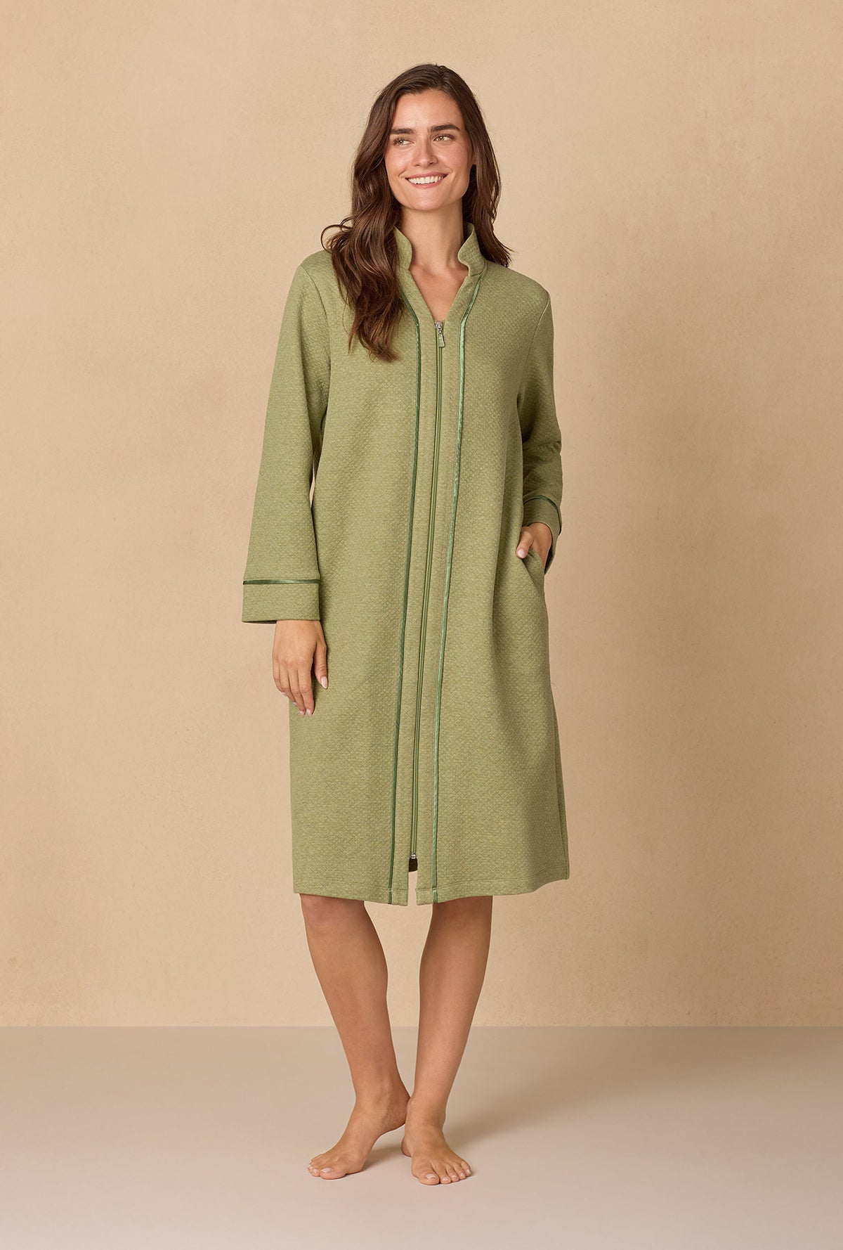 A lady wearing Heather Sage Diamond Quilted Zip Robe