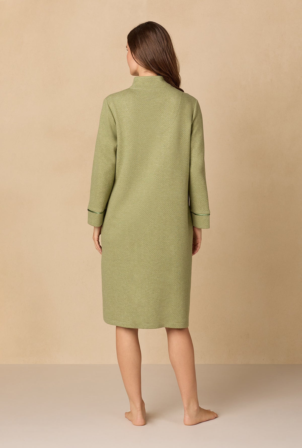 A lady wearing Heather Sage Diamond Quilted Zip Robe