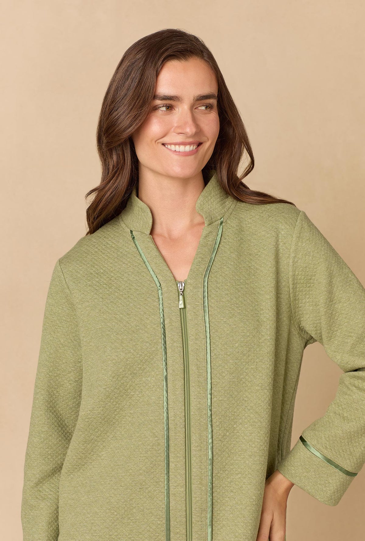 A lady wearing Heather Sage Diamond Quilted Zip Robe