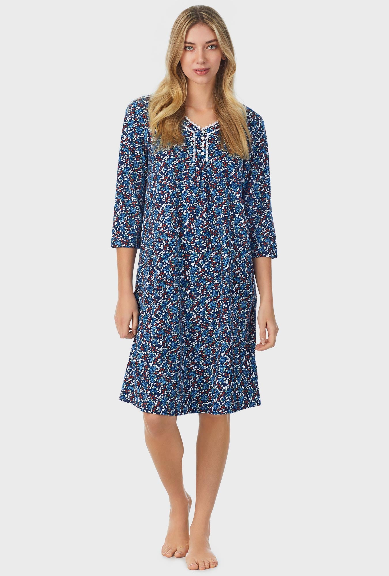 A lady wearing blue quarter sleeve waltz nightgown with moonlight print.