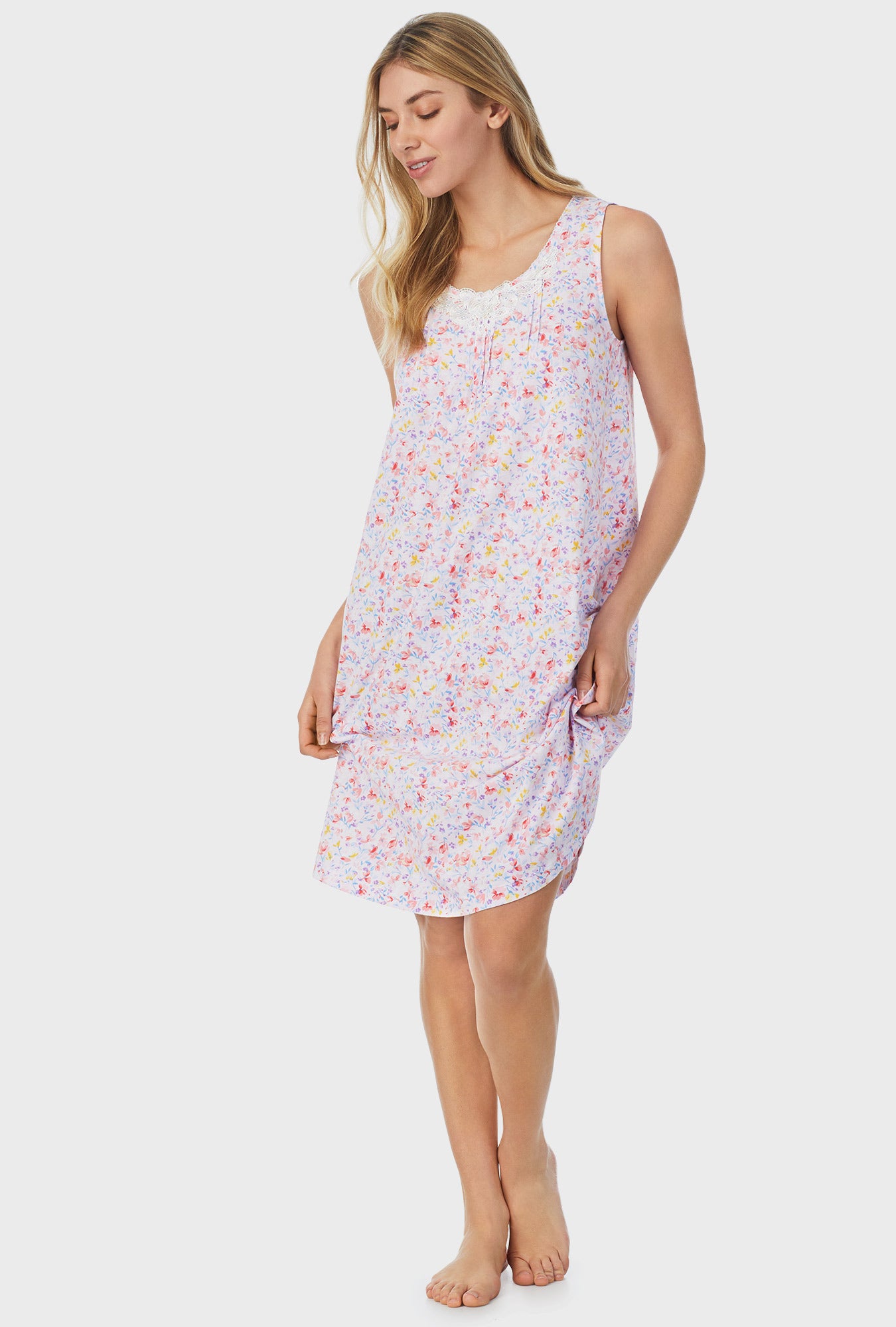 A lady wearing white sleeveless Waltz Nightgown with Garden Floral print