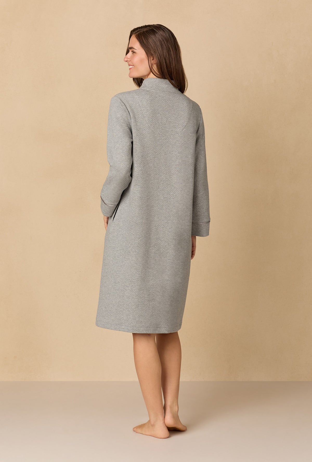 A lady wearing Heather Grey Diamond Quilted Zip Robe