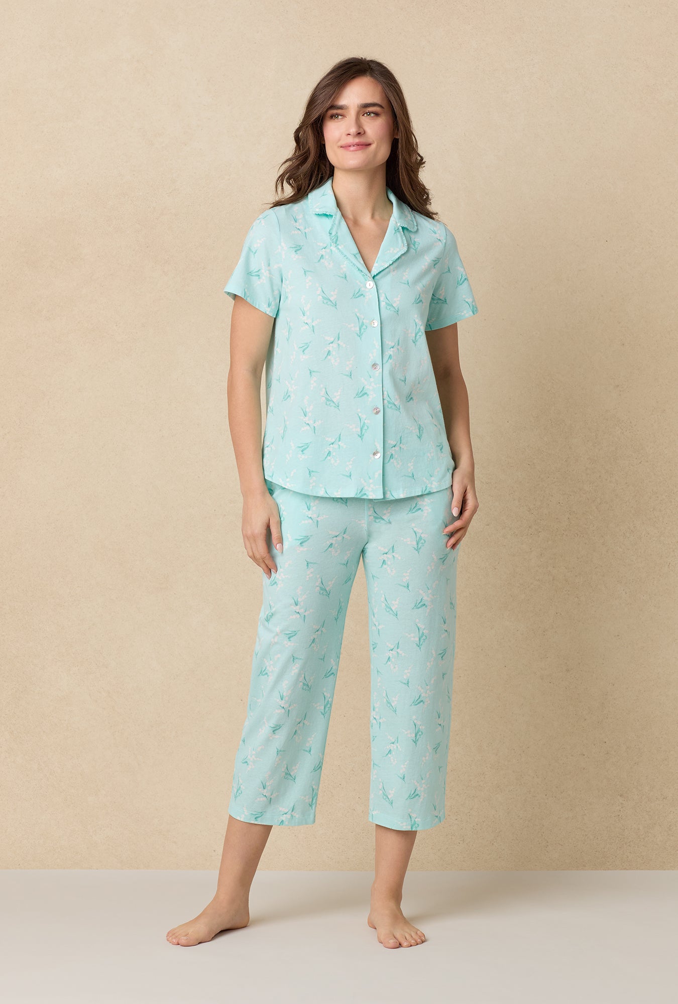 A lady wearing Lily Of The Valley Cotton Capri Pajama Set