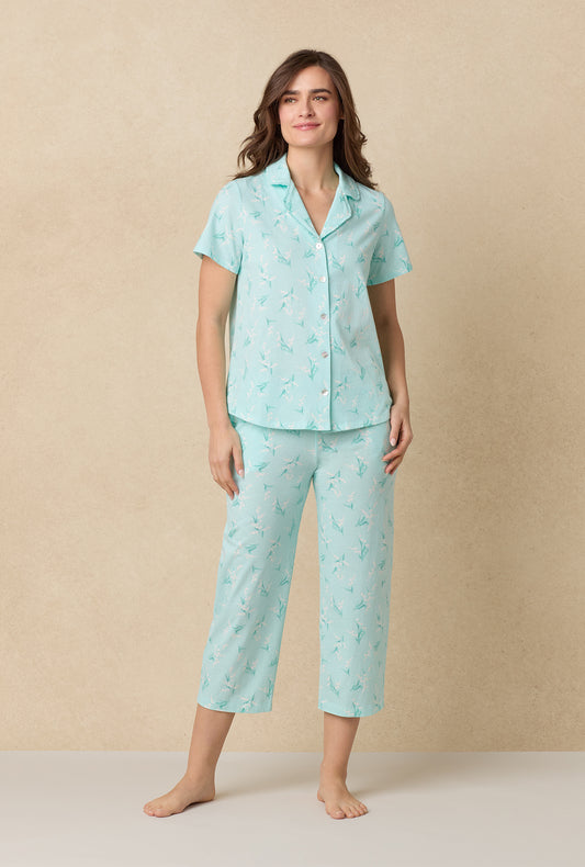 A lady wearing Lily Of The Valley Cotton Capri Pajama Set
