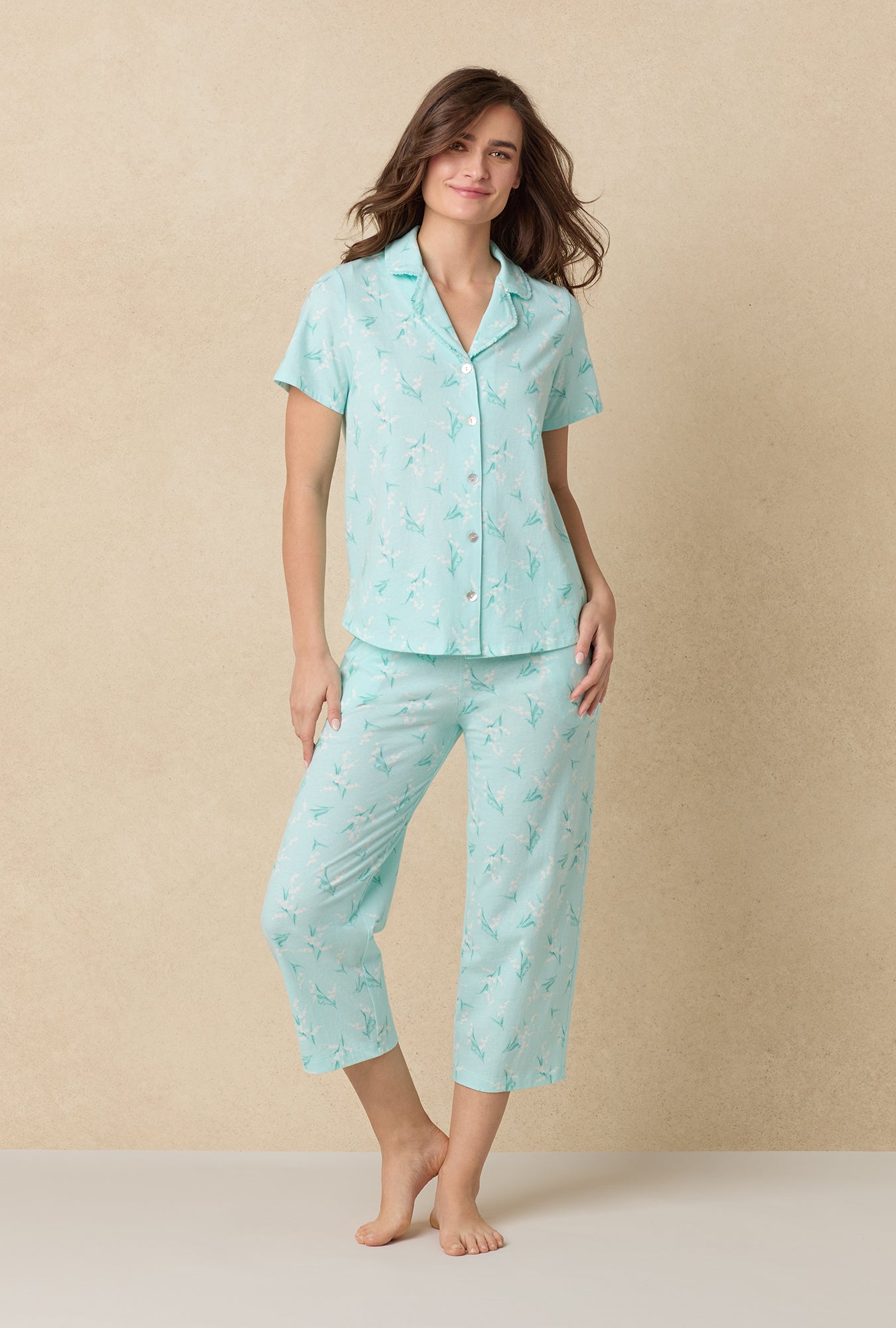 A lady wearing Lily Of The Valley Cotton Capri Pajama Set