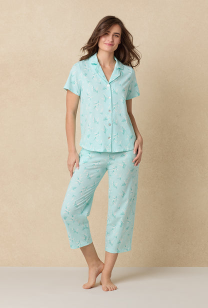 A lady wearing Lily Of The Valley Cotton Capri Pajama Set