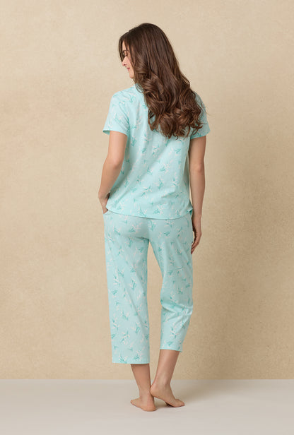 A lady wearing Lily Of The Valley Cotton Capri Pajama Set