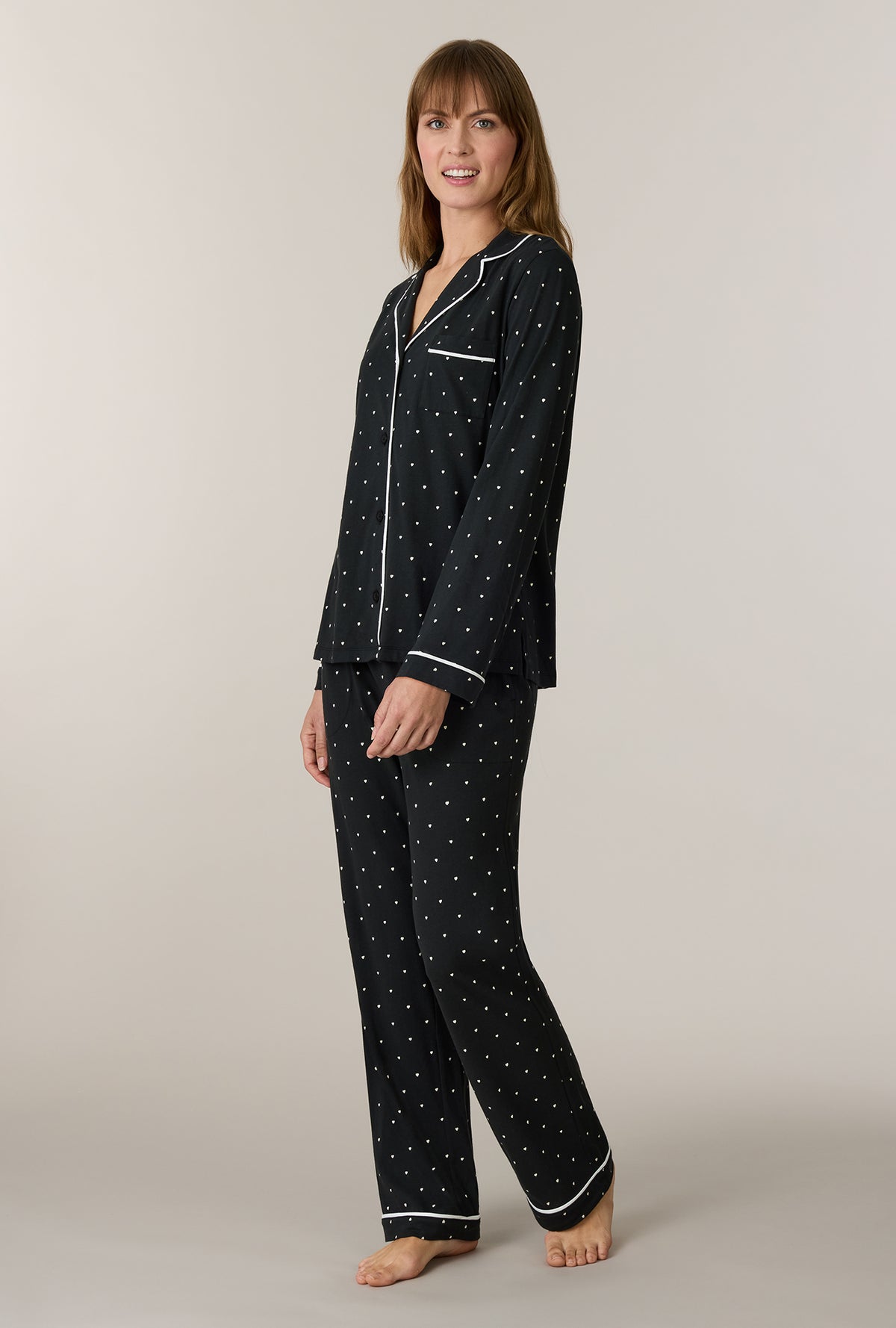 A lady wearing Midnight Hearts Cotton Notch Collar Long Pajama Set walking