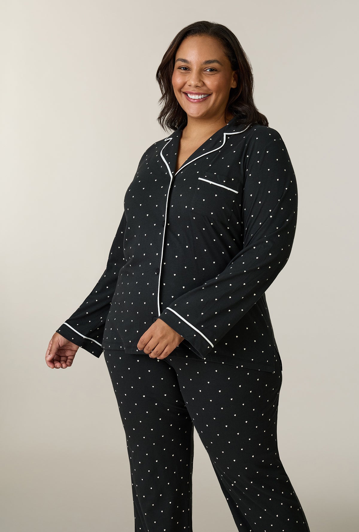A lady wearing plus size Midnight Hearts Cotton Notch Collar Long Pajama Set closer look