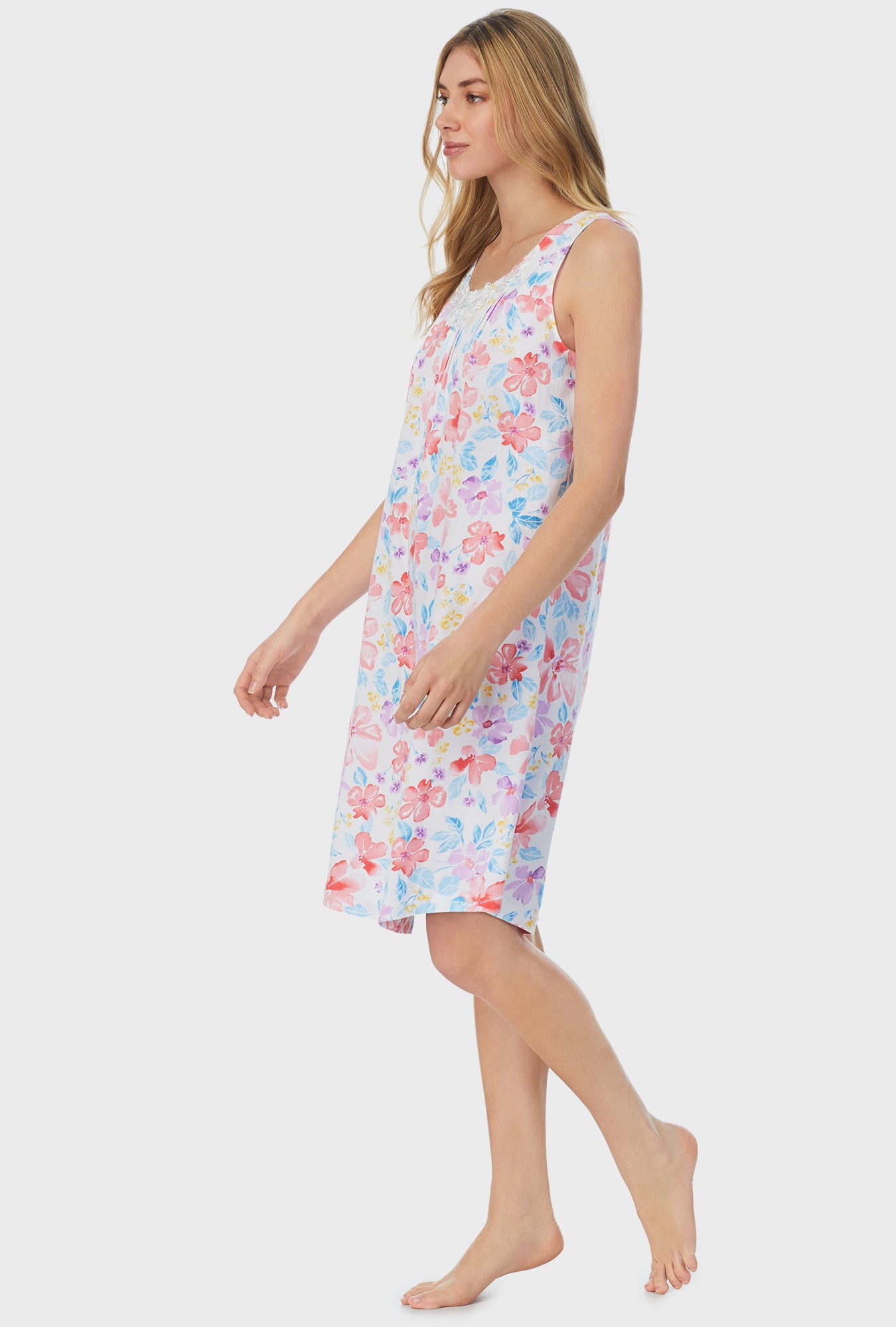 A lady wearing white Waltz Nightgown with Tropical Blooms print