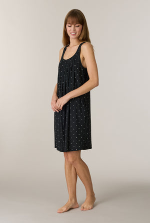 A lady wearing Midnight Hearts Cotton Short Chemise looking down