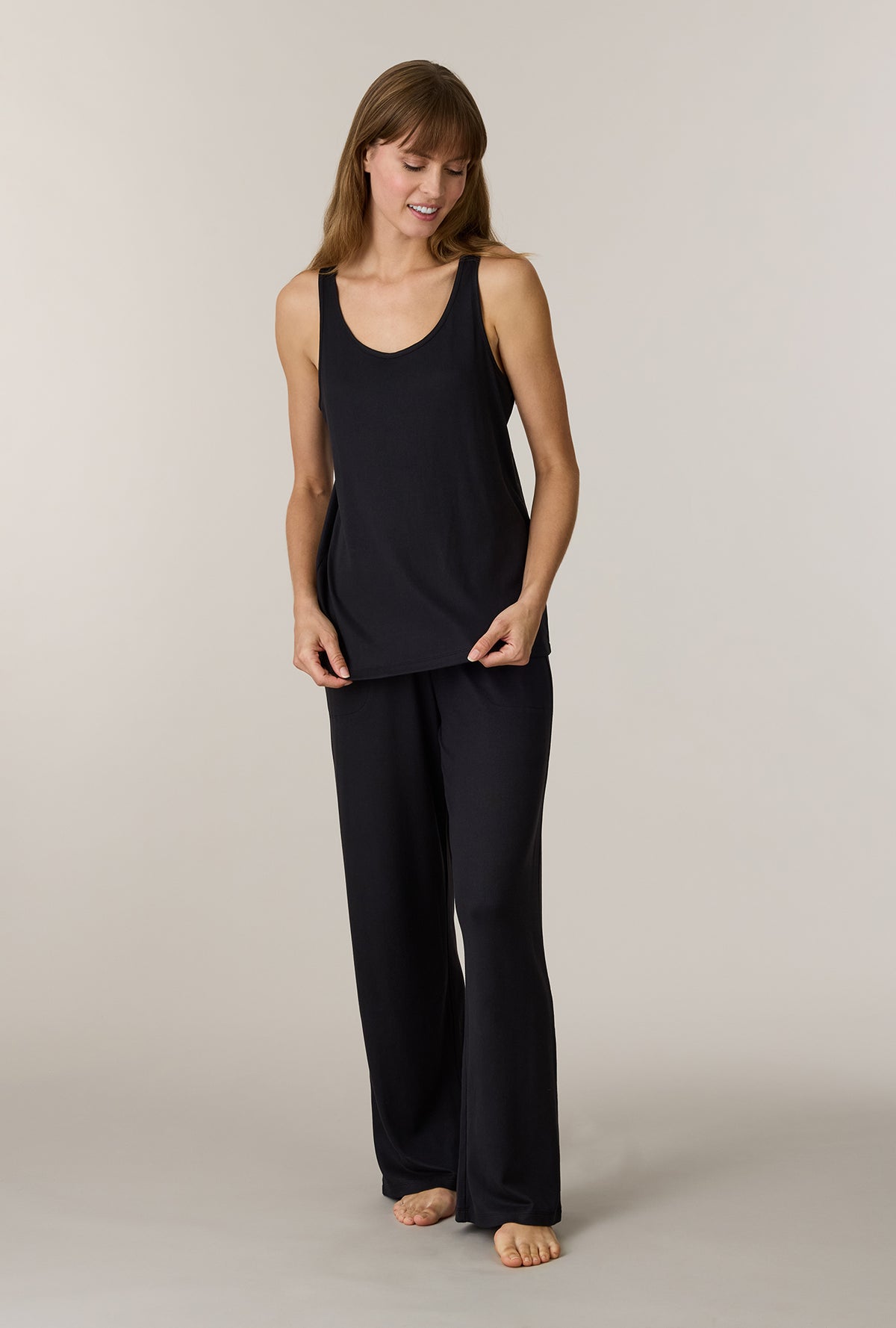 A lady wearing Black 3-Piece Brushed Sweater Knit Pajama Set without robe