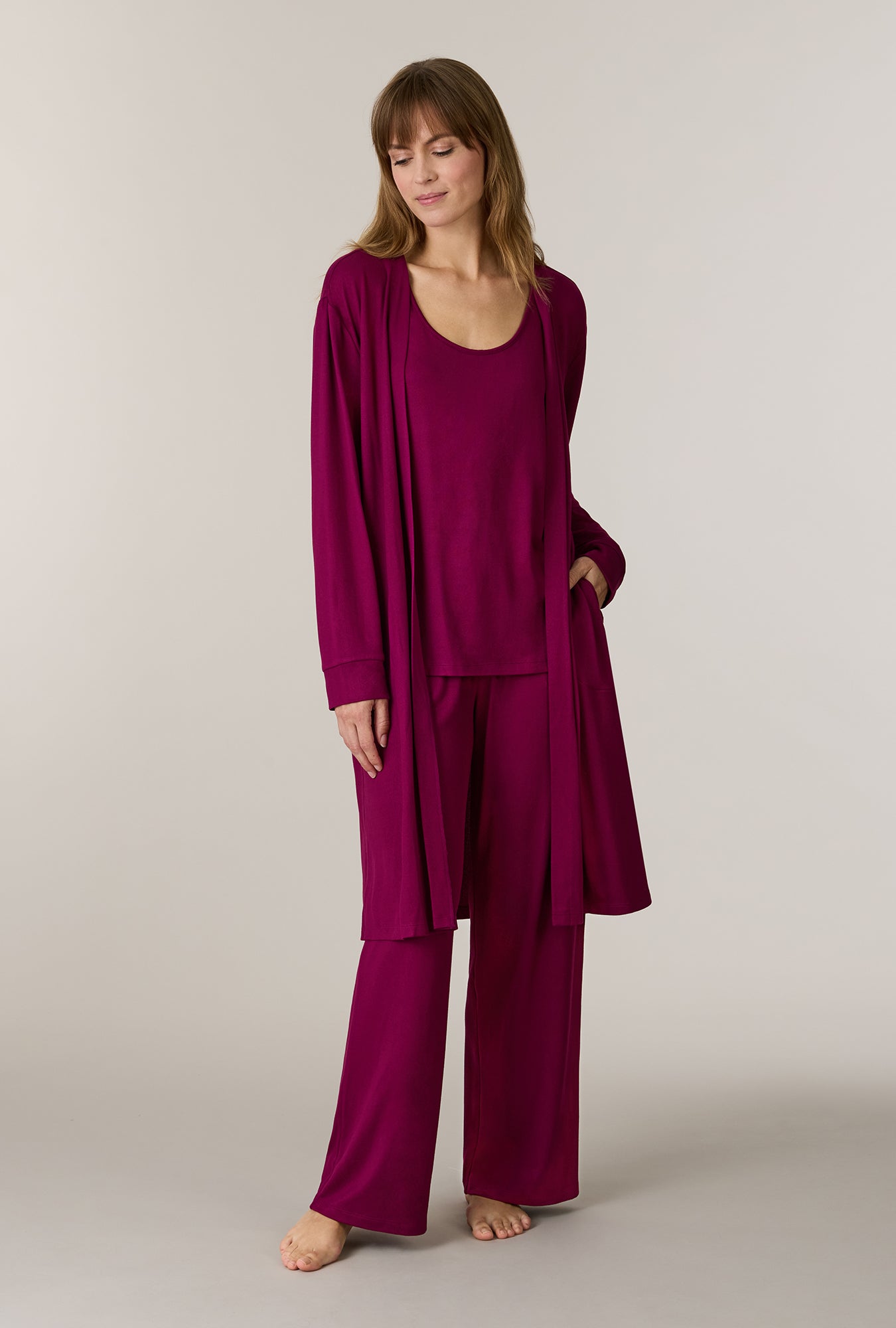 A lady wearing Burgundy 3-Piece Brushed Sweater Knit Pajama Set looking down