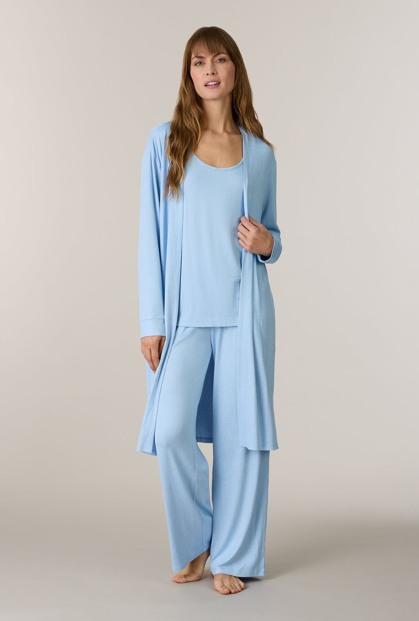 A lady wearing Heather Sky Blue 3-Piece Brushed Sweater Knit Pajama Set