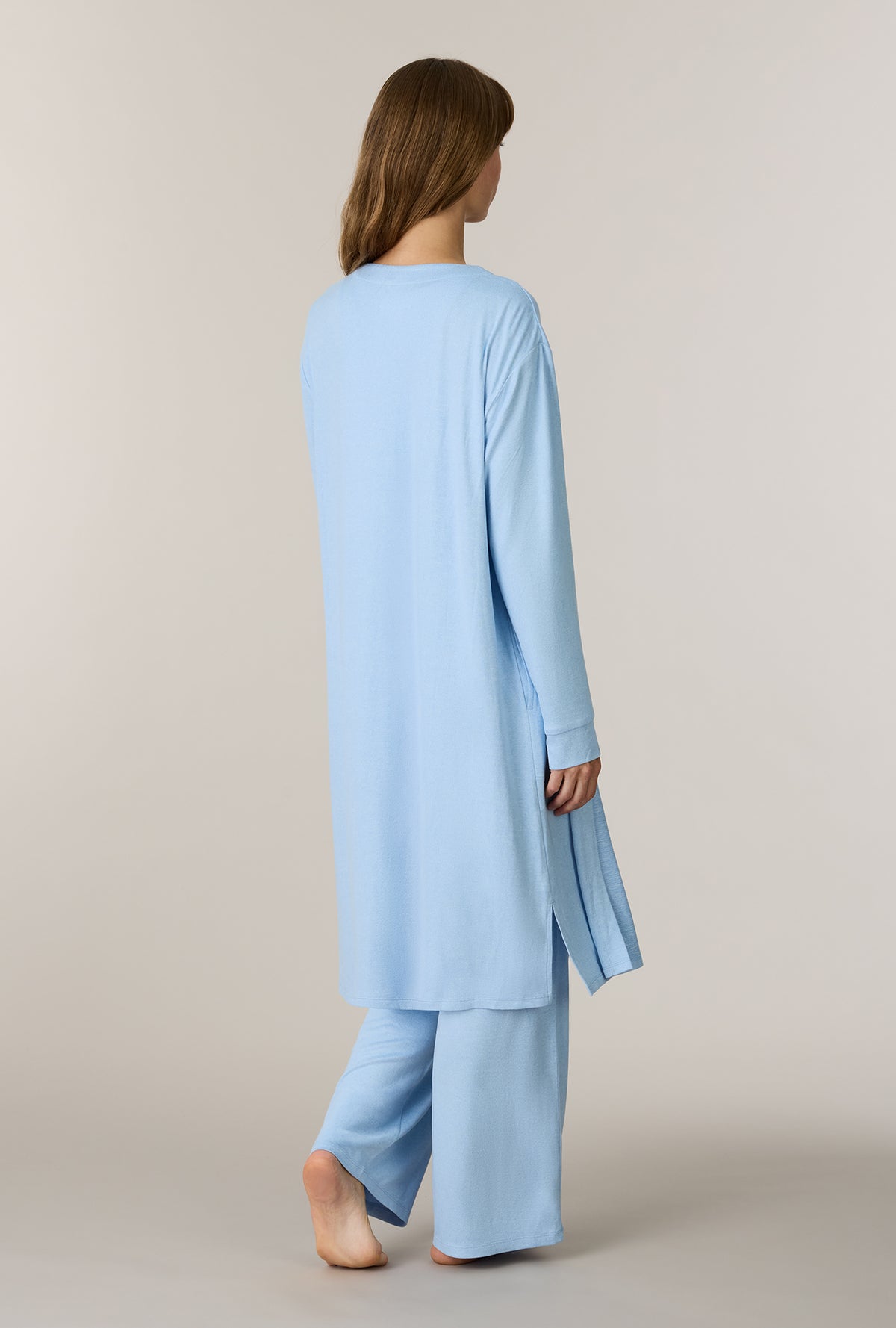 A lady wearing Heather Sky Blue 3-Piece Brushed Sweater Knit Pajama Set back view 