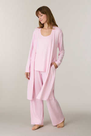 A lady wearing Heather Blush 3-Piece Brushed Sweater Knit Pajama Set looking down