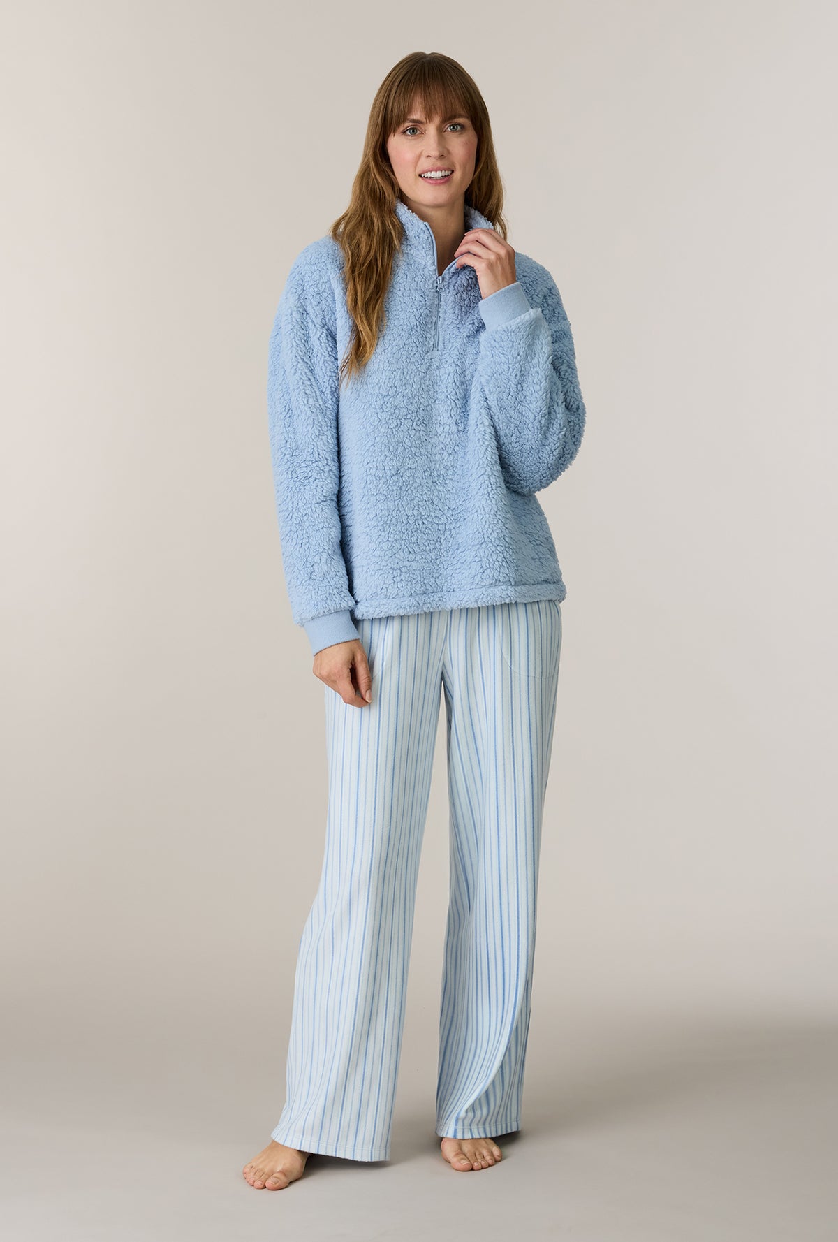 A lady wearing Coastal Stripe Sherpa Zip Top & Stretch Fleece Pajama Set