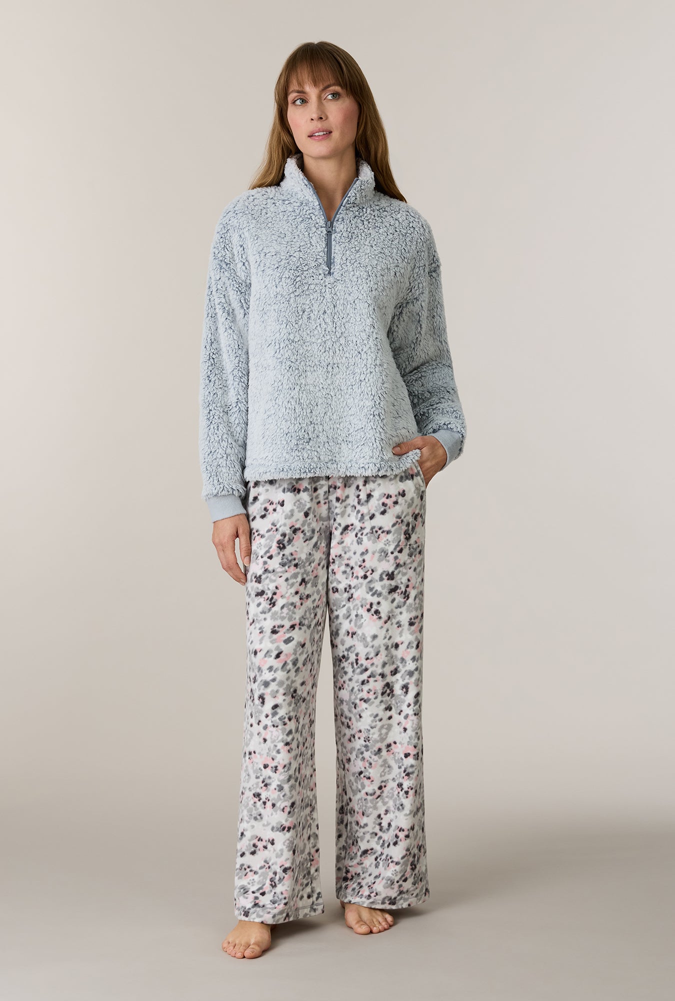A lady wearing Soft Leopard Sherpa Zip Top & Stretch Fleece Pajama Set looking side