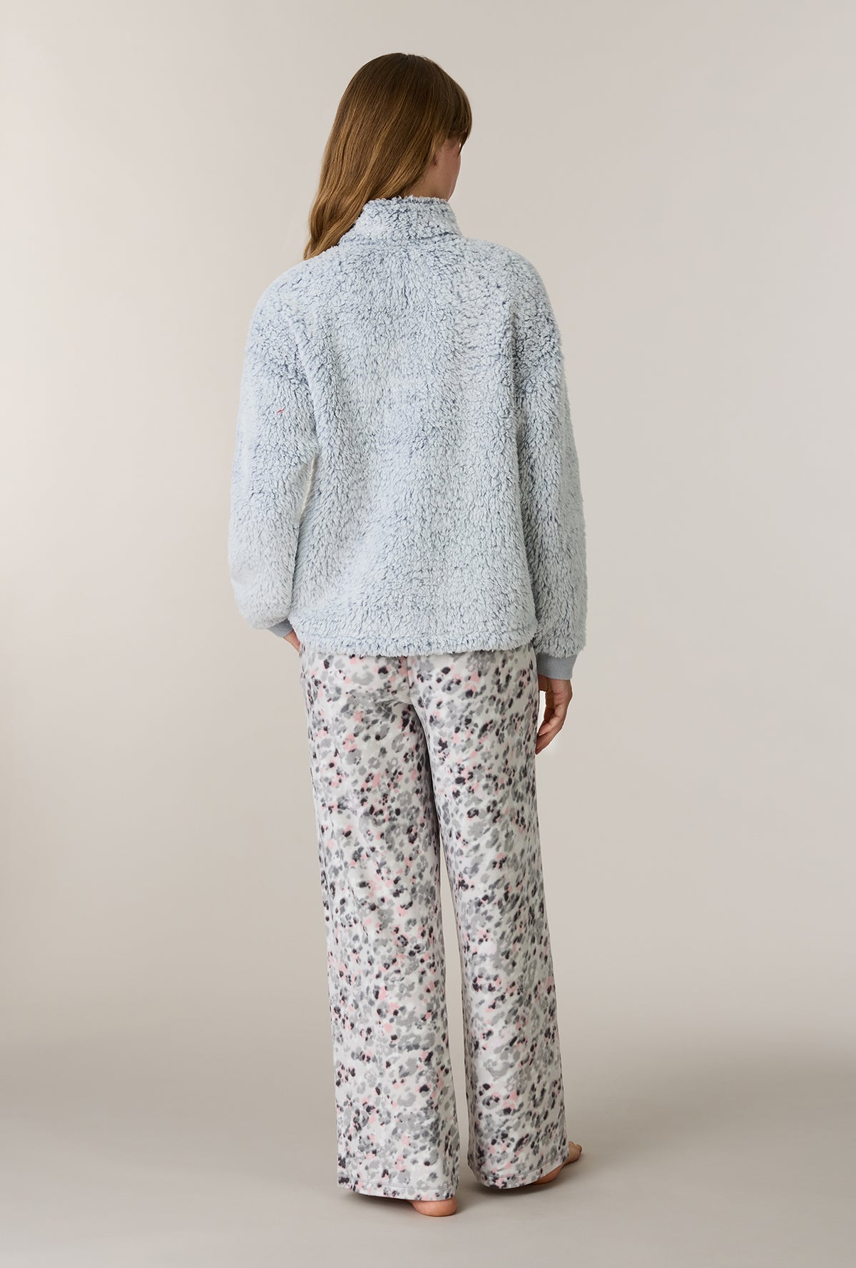 A lady wearing Soft Leopard Sherpa Zip Top & Stretch Fleece Pajama Set back view