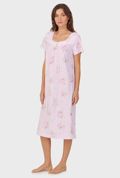 A lady wearing Pink Cosmos Cap Sleeve Cotton Waltz Nightgown