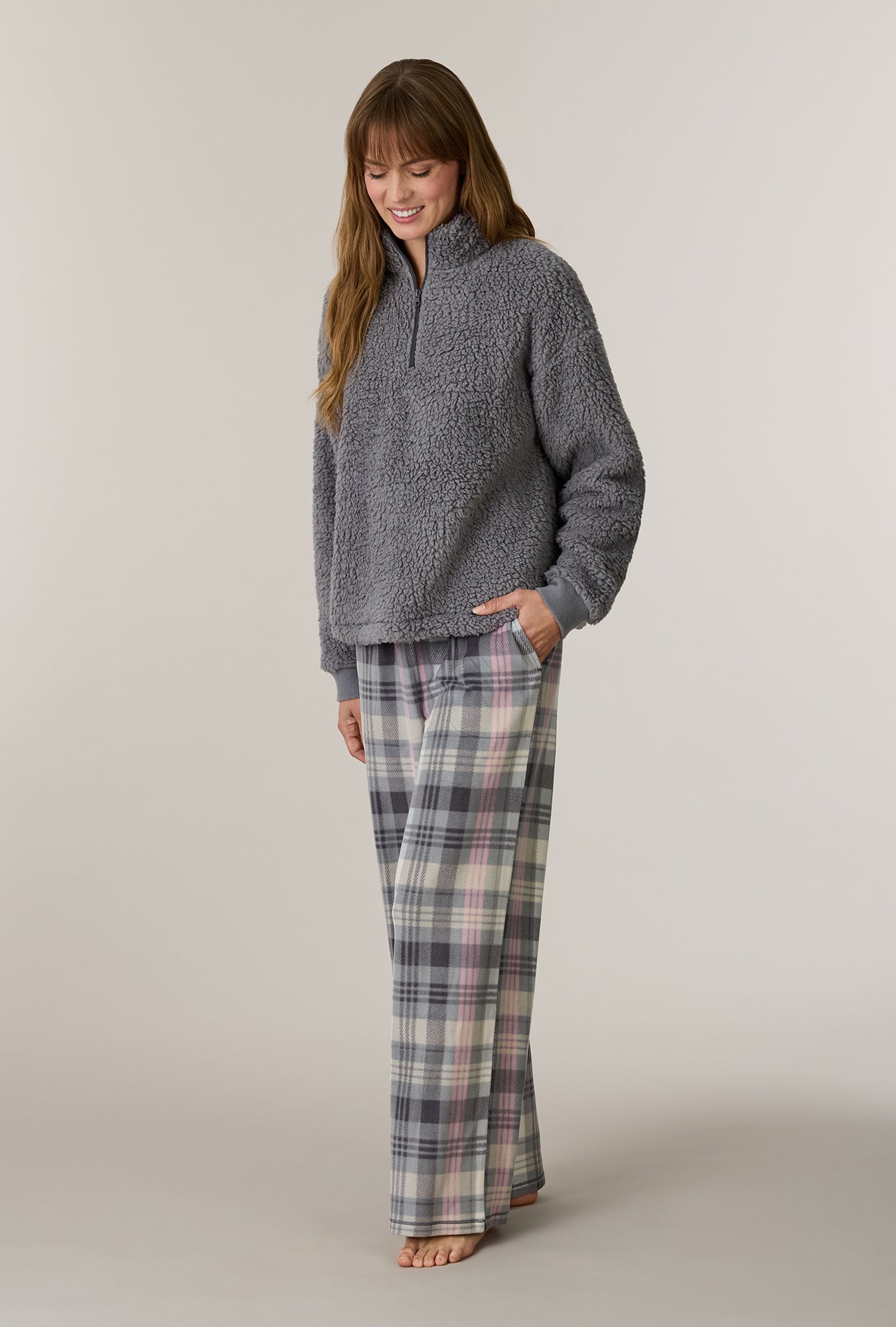 A lady wearing Charcoal Plaid Sherpa Zip Top & Stretch Fleece Pajama Set