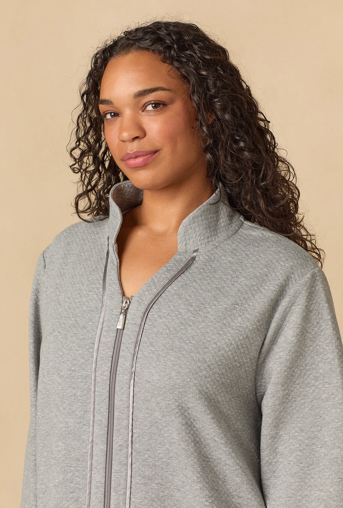 A lady wearing Heather Grey Diamond Quilted Plus Zip Robe