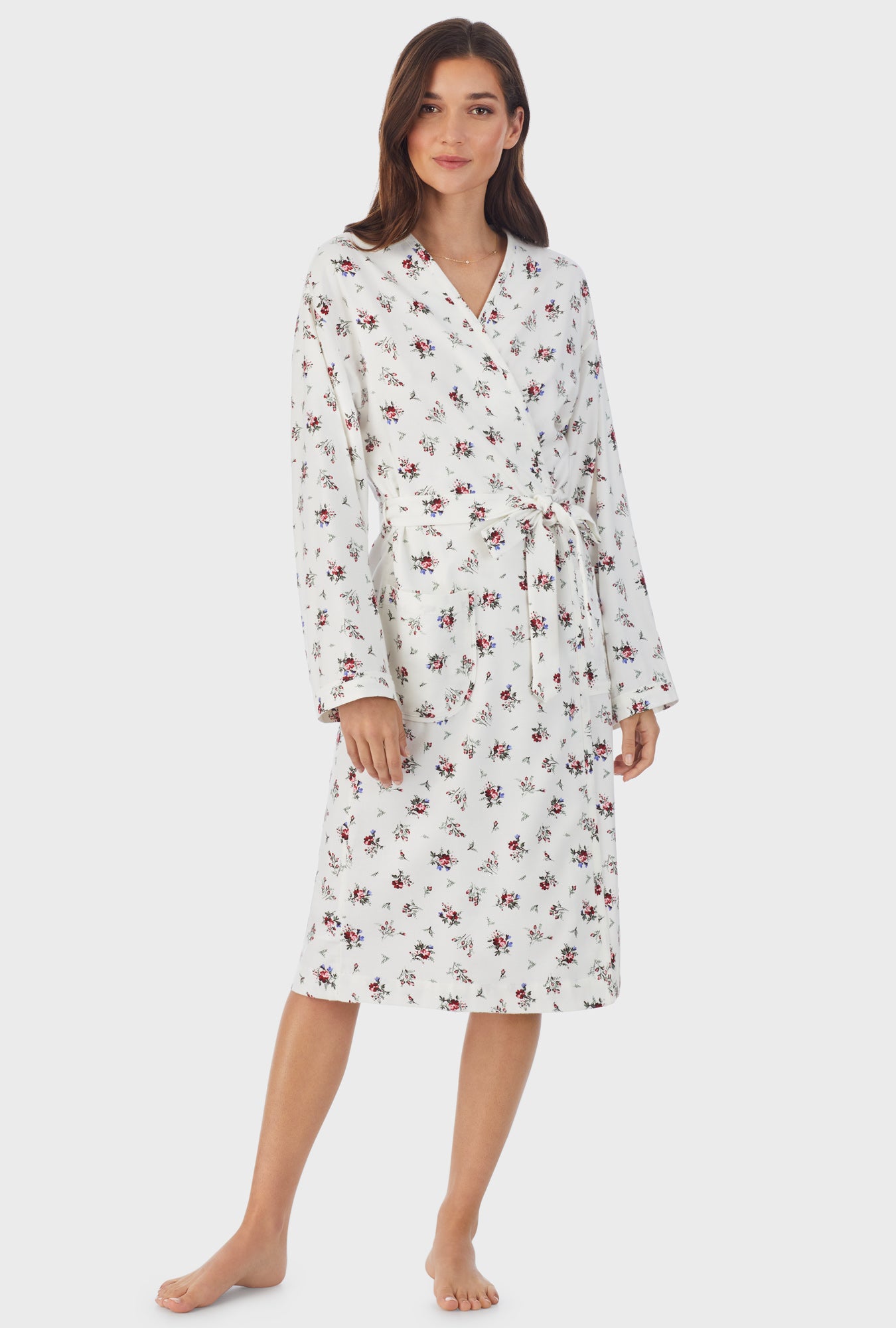 A lady wearing white long sleeve cotton rayon flannel wild flower wrap robe.