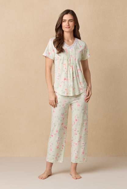A lady wearing Sage Floral Bloom Capri Cotton Knit Pajama Set
