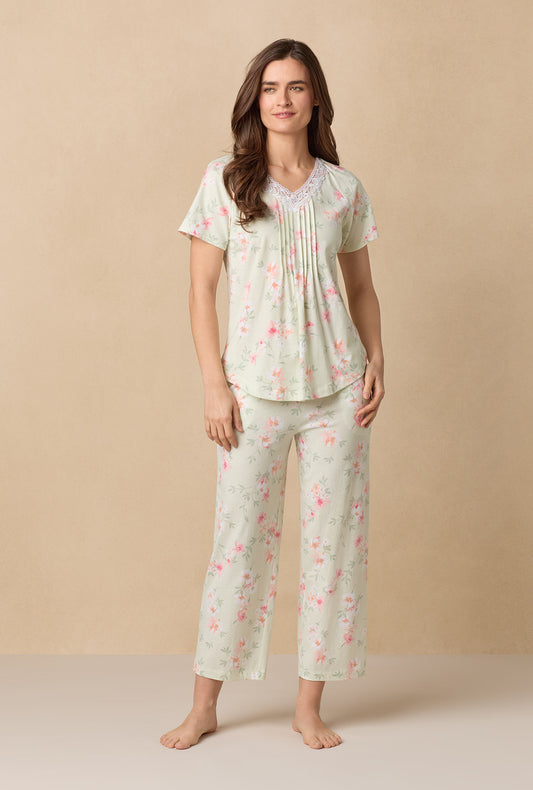 A lady wearing Sage Floral Bloom Capri Cotton Knit Pajama Set