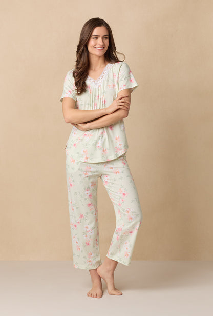 A lady wearing Sage Floral Bloom Capri Cotton Knit Pajama Set