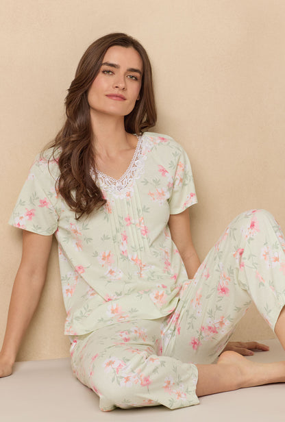 A lady wearing Sage Floral Bloom Capri Cotton Knit Pajama Set