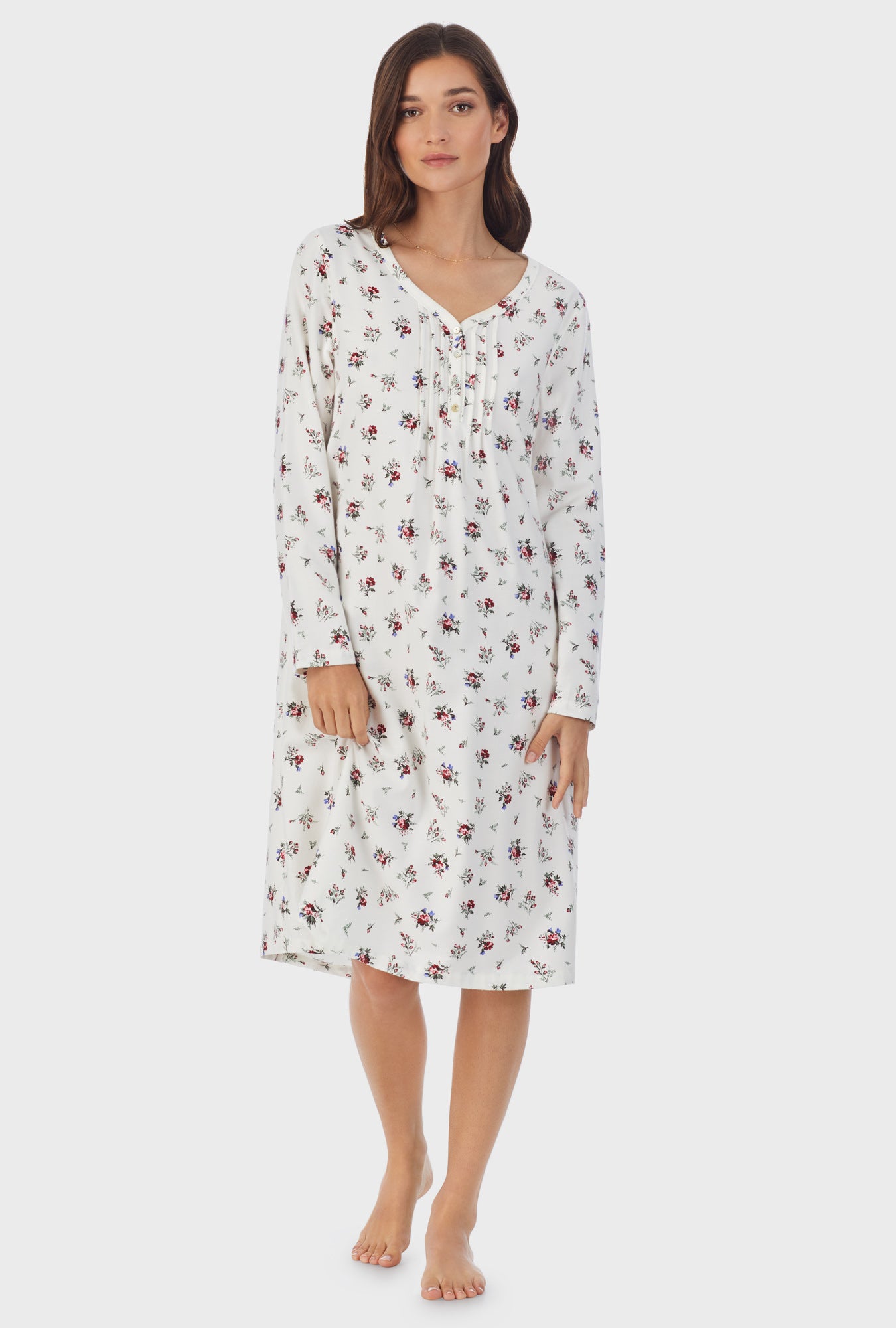 A lady wearing white long sleeve cotton rayon flannel waltz wild flower nightgown.