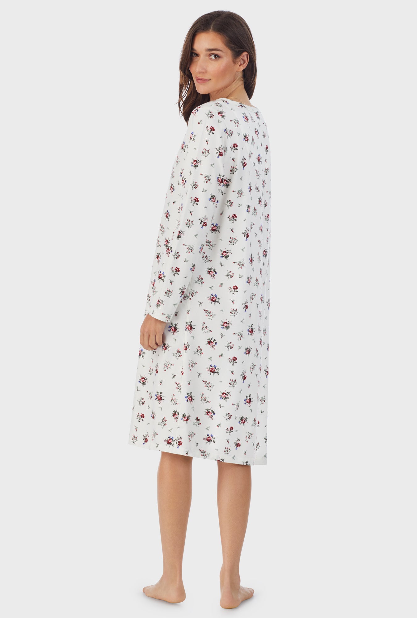 A lady wearing white long sleeve cotton rayon flannel waltz wild flower nightgown.