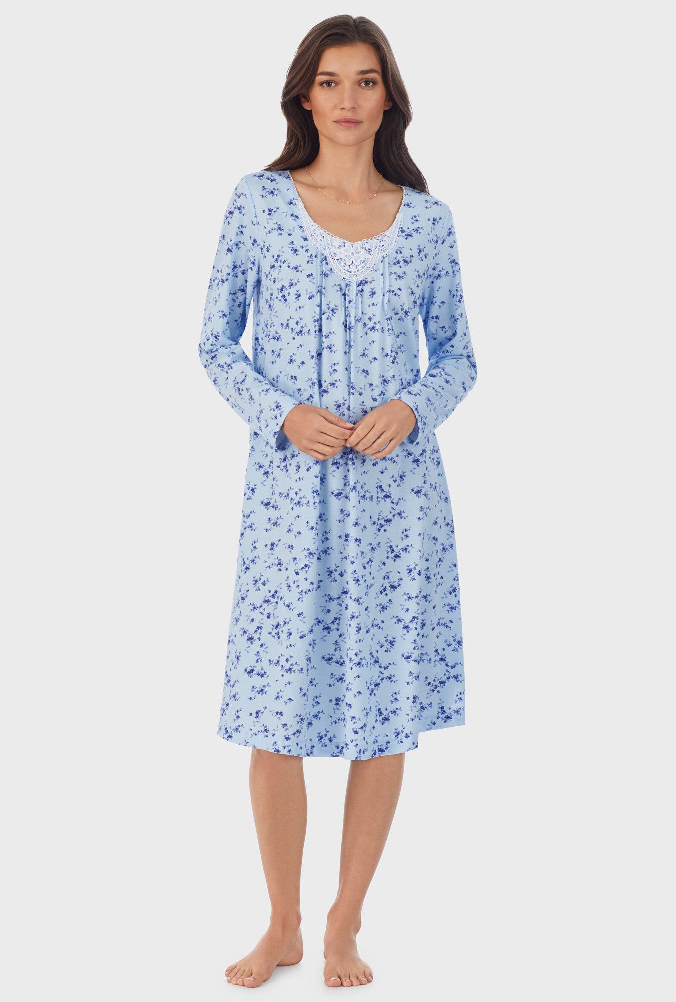 A lady wearing blue long sleeve cotton waltz nightgown with winter floral print.
