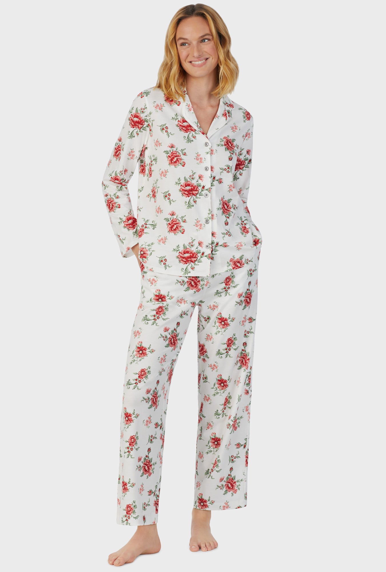 A lady wearing white long sleeve long royal garden pajama set.