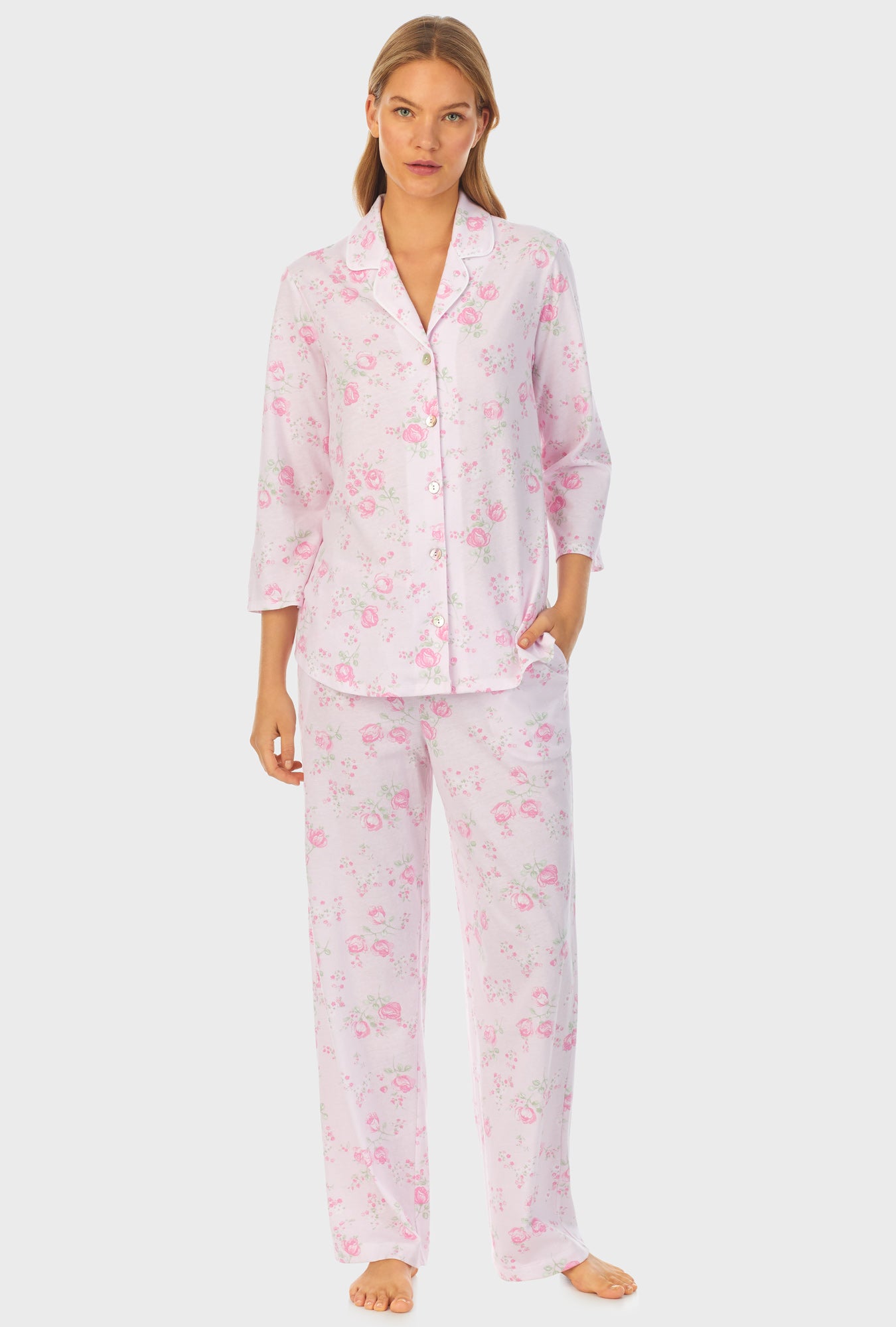 A lady wearing pink long sleeve cotton long pajama set with sweet rose print.
