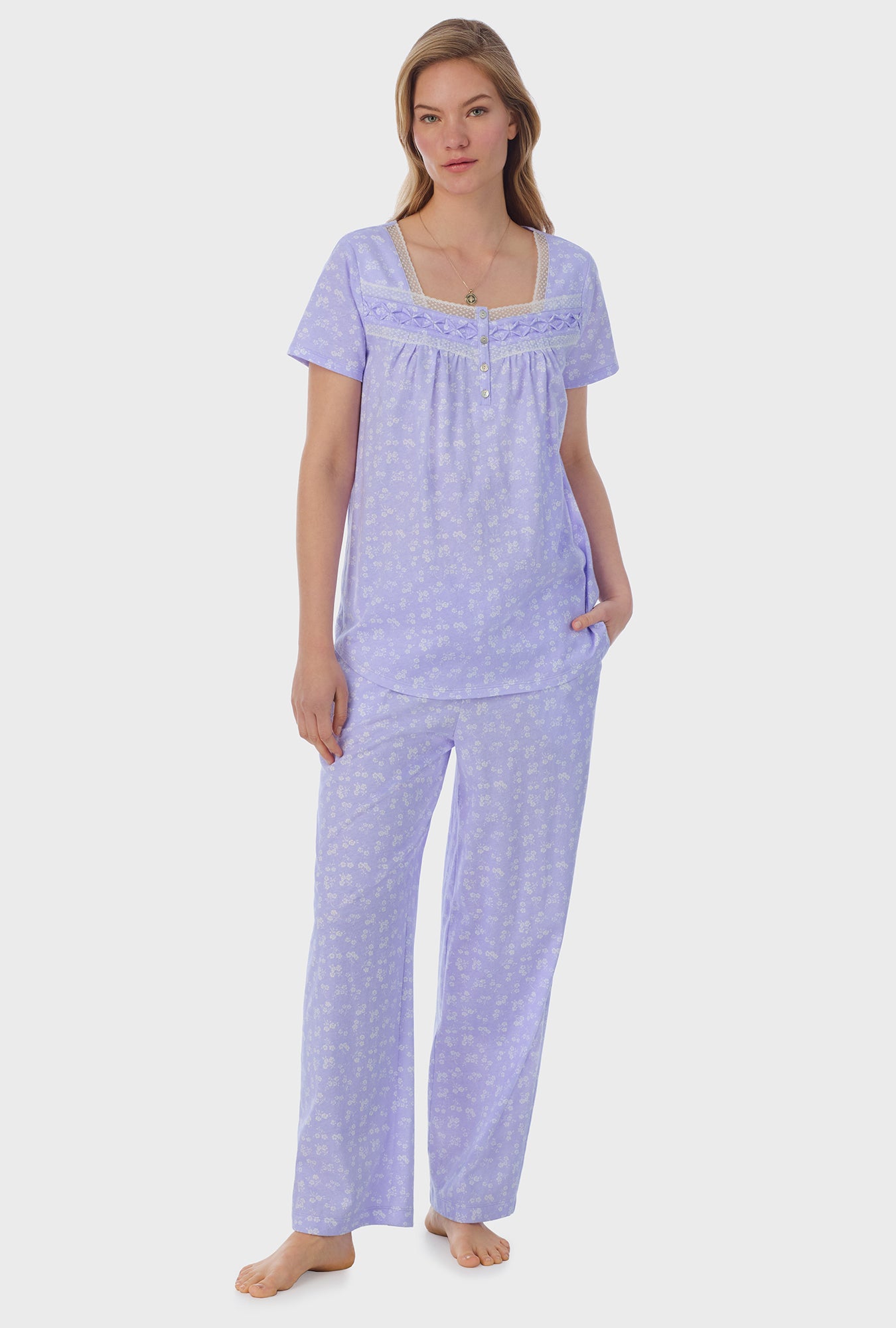 A lady wearing purple short Sleeve Cotton Capri Pajama Set with Sweet Ditsy print