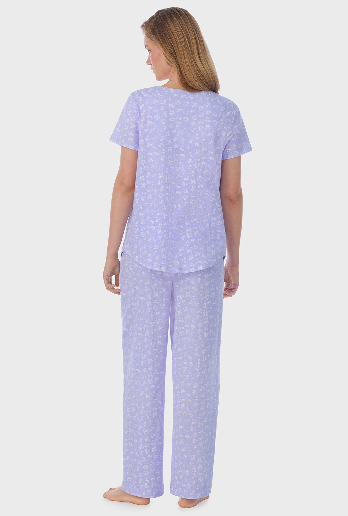 A lady wearing purple short Sleeve Cotton Capri Pajama Set with Sweet Ditsy print