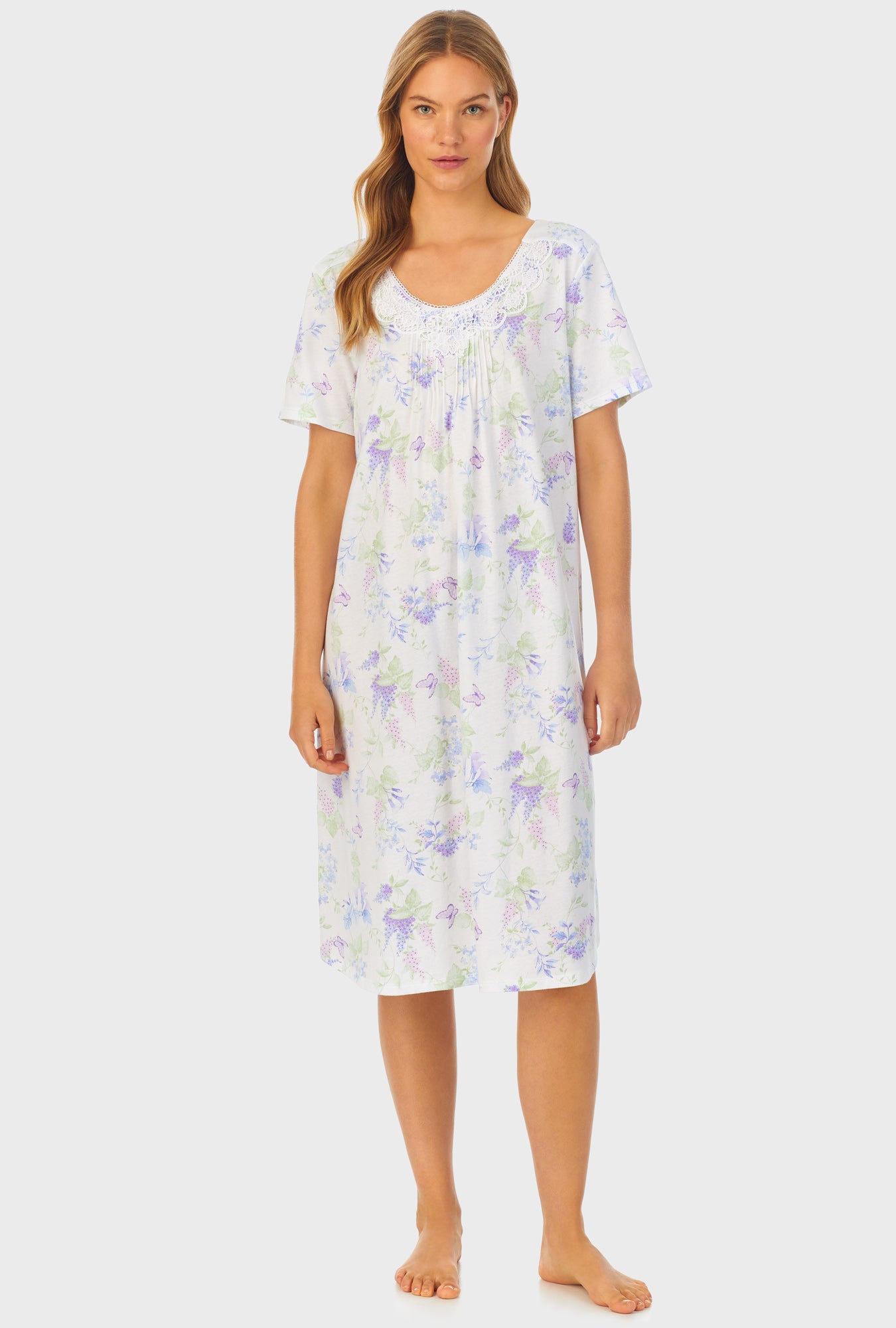 A lady wearing Cotton Waltz Nightgown with Butterfly Garden print