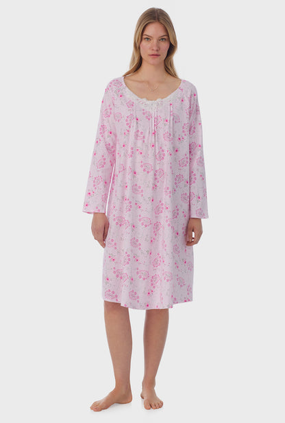 A lady wearing long sleeve Waltz Nightgown with Paisley Floral print 