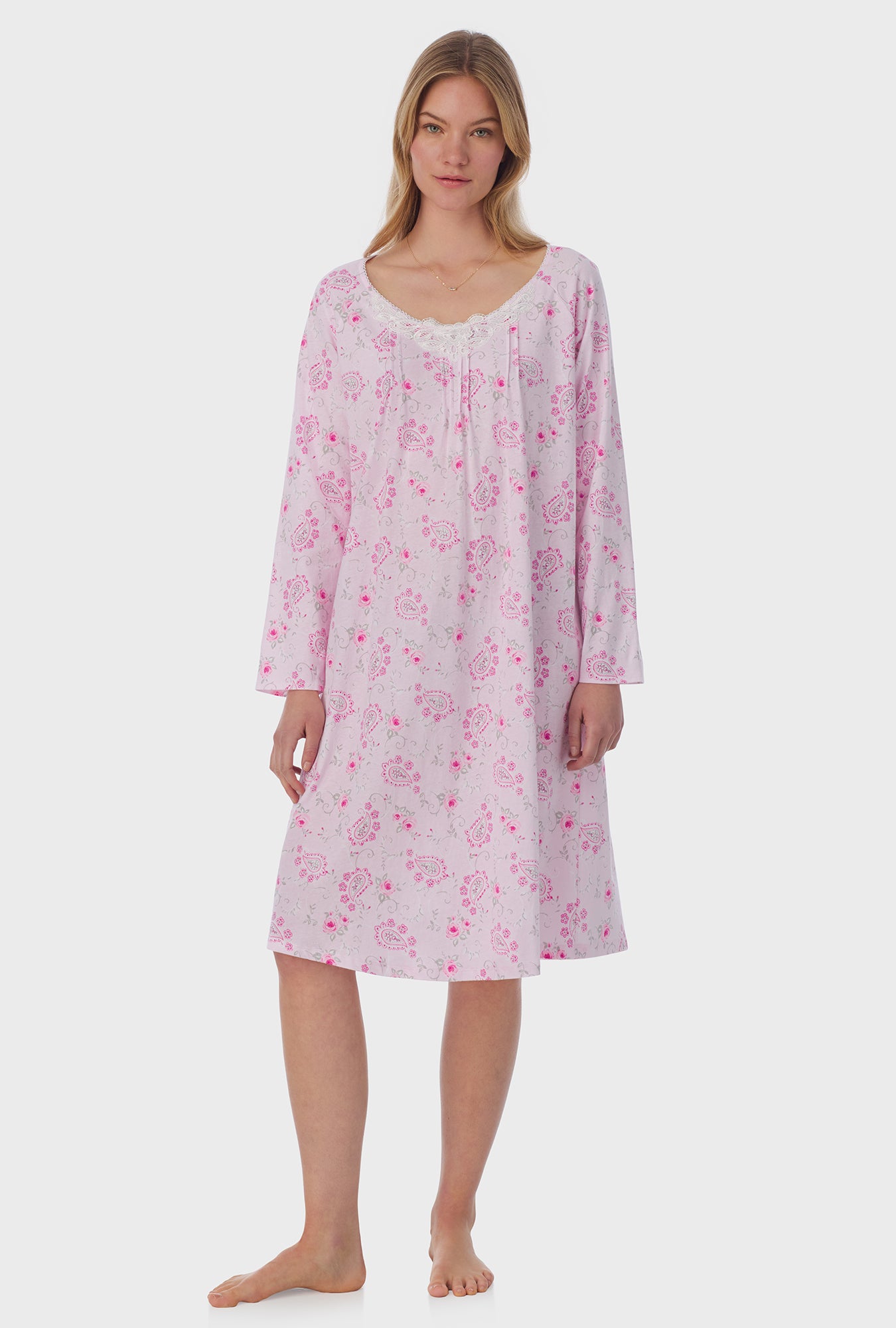 A lady wearing long sleeve Waltz Nightgown with Paisley Floral print 