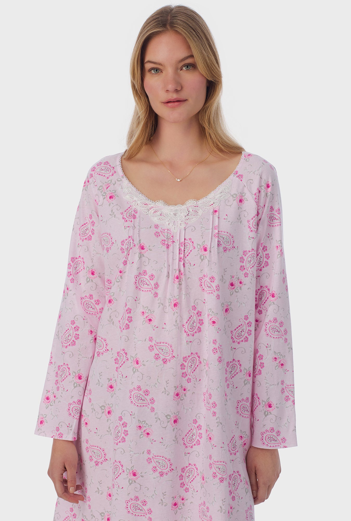 A lady wearing long sleeve Waltz Nightgown with Paisley Floral print 