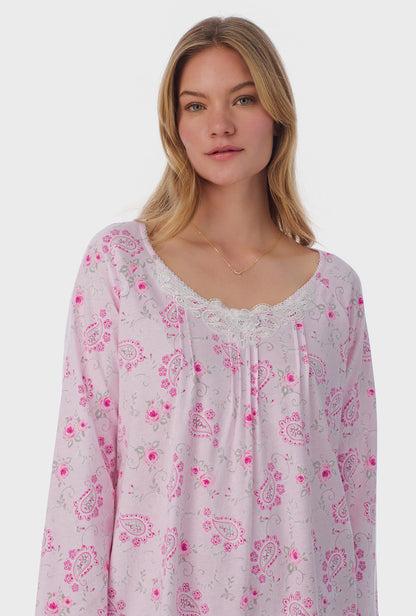 A lady wearing long sleeve Waltz Nightgown with Paisley Floral print 