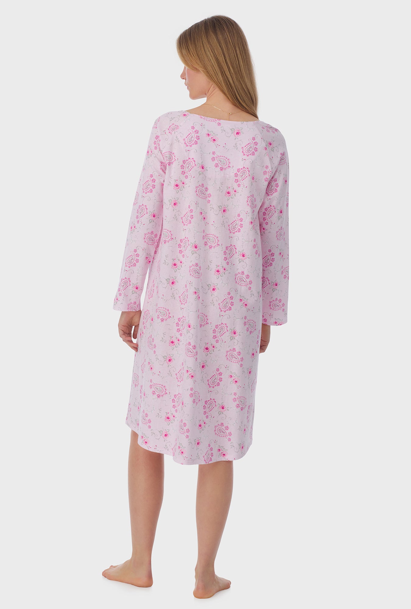 A lady wearing long sleeve Waltz Nightgown with Paisley Floral print 