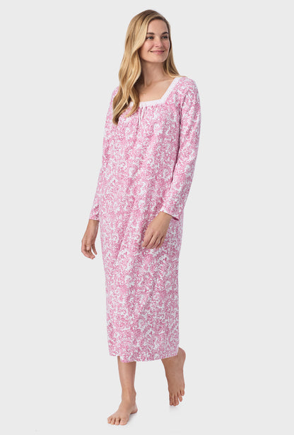 A lady wearing ballet nightgown with berry paisley print