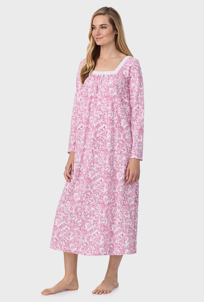 A lady wearing ballet nightgown with berry paisley print